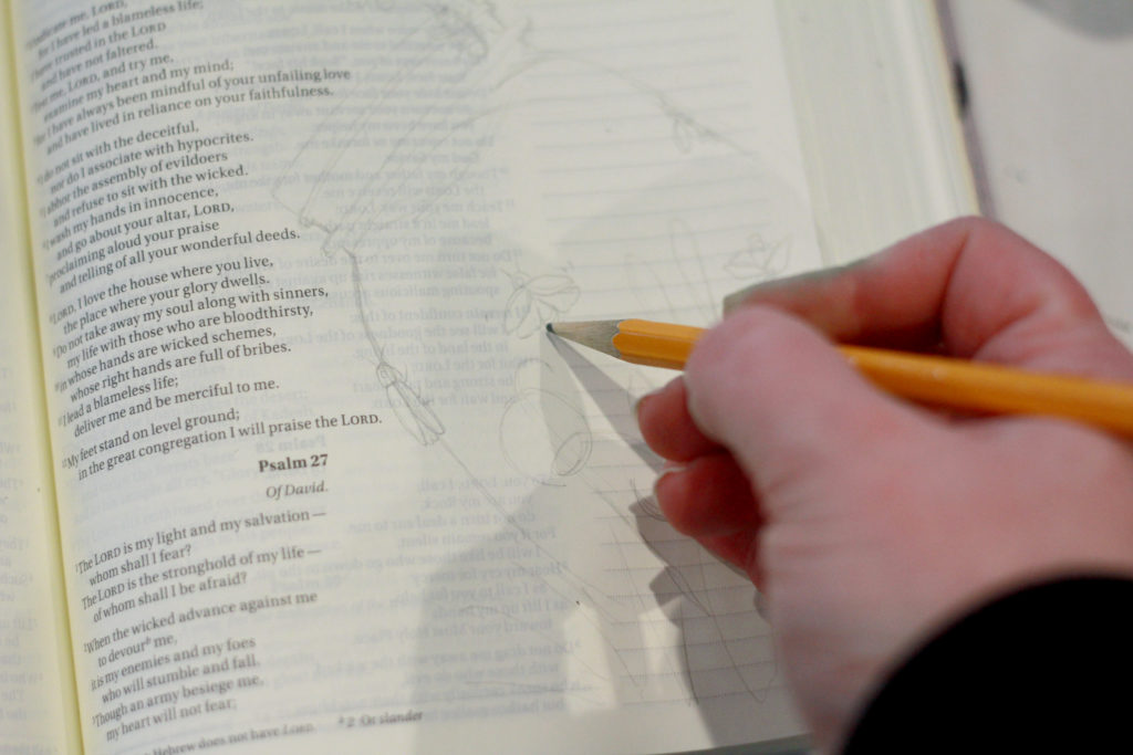 Photo of a Bible journaling page being drawn; Bible open to Psalm 27