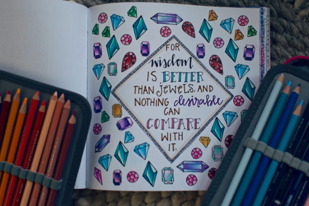 A coloring page with colorful gems and the Bible Verse "for wisdom is better than jewels, and nothing desirable can compare with it"
